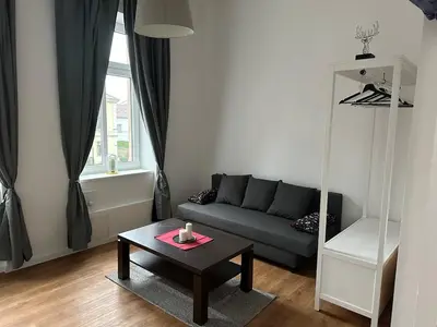 Ein Sitzbereich in der Unterkunft Gemütliche Wohnung mit Hochbett