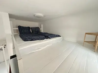 Ein Bett oder Betten in einem Zimmer der Unterkunft Gemütliche Wohnung mit Hochbett