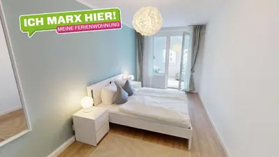 Ein Bett oder Betten in einem Zimmer der Unterkunft Wohnen im Jugendstilviertel Kaßberg, WLAN