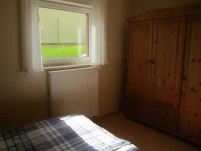 Ein Bett oder Betten in einem Zimmer der Unterkunft Ferienwohnung Benz