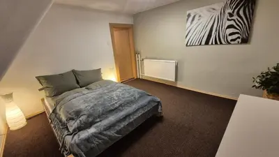 Ein Bett oder Betten in einem Zimmer der Unterkunft Am Trebeteich