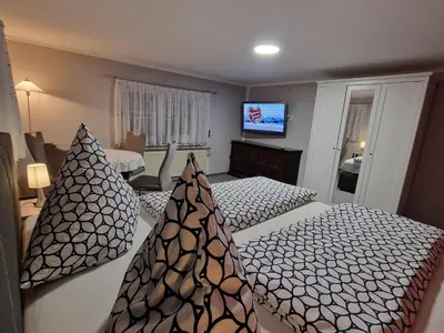 Ein Bett oder Betten in einem Zimmer der Unterkunft Ferienwohnung Heike Rinno
