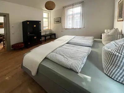 Ein Bett oder Betten in einem Zimmer der Unterkunft Wauermühle
