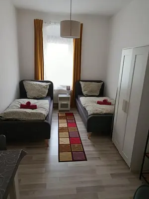 Ein Bett oder Betten in einem Zimmer der Unterkunft Ferienwohnung - Monteur Sleep 1 - max 6 Personen