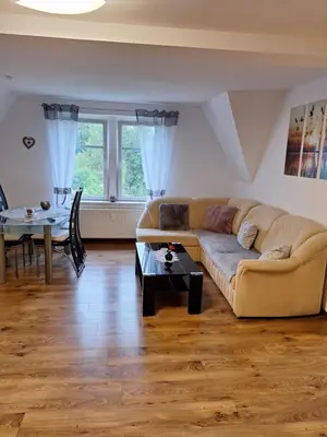 Ein Sitzbereich in der Unterkunft Ferienwohnung Rote-Villa