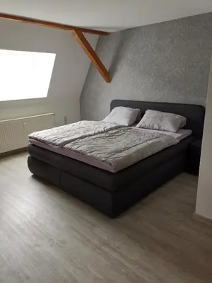 Ein Bett oder Betten in einem Zimmer der Unterkunft Ferienwohnung Rote-Villa