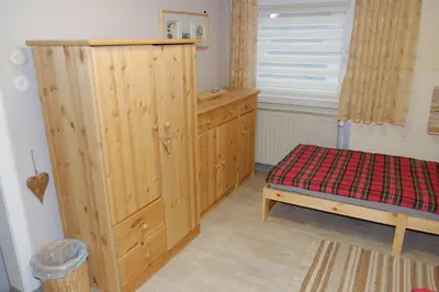 Ein Bett oder Betten in einem Zimmer der Unterkunft Pension & Ferienwohnung Zum Waldblick