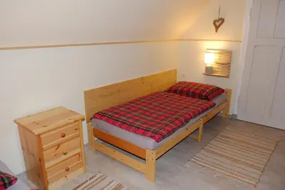 Ein Bett oder Betten in einem Zimmer der Unterkunft Pension & Ferienwohnung Zum Waldblick