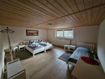 Ein Bett oder Betten in einem Zimmer der Unterkunft Ferienwohnung Weigl