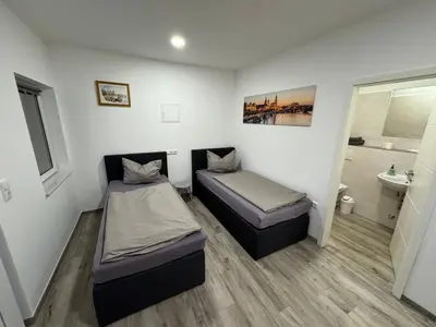 Ein Bett oder Betten in einem Zimmer der Unterkunft Pension Hertel
