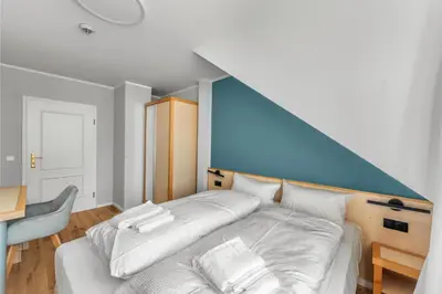 Ein Bett oder Betten in einem Zimmer der Unterkunft Hotel Friedrichstadt