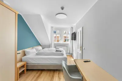 Ein Bett oder Betten in einem Zimmer der Unterkunft Hotel Friedrichstadt