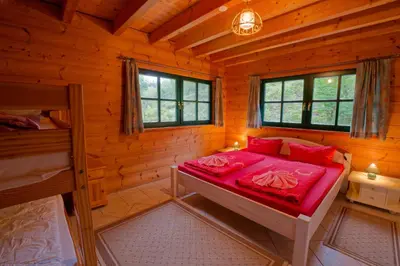 Ein Bett oder Betten in einem Zimmer der Unterkunft Falkenstein Hütten Haus Waldluft