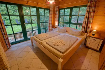Ein Bett oder Betten in einem Zimmer der Unterkunft Falkenstein Hütten Haus Waldluft