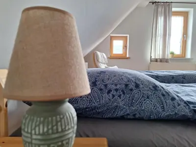 Ein Bett oder Betten in einem Zimmer der Unterkunft Ferienwohnung am Auenweg