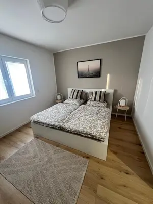 Ein Bett oder Betten in einem Zimmer der Unterkunft Exklusive und moderne Ferienwohnung