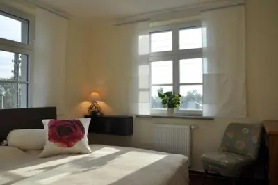 Ein Bett oder Betten in einem Zimmer der Unterkunft Pension AM REICHEN BERG