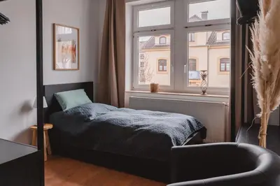 Ein Bett oder Betten in einem Zimmer der Unterkunft One4Five Apartments, Stadthaus, gemütliches Wohnen in Dresden