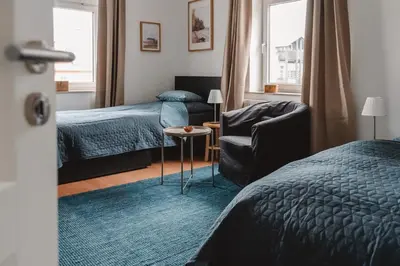 Ein Bett oder Betten in einem Zimmer der Unterkunft One4Five Apartments, Stadthaus, gemütliches Wohnen in Dresden