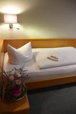 Ein Bett oder Betten in einem Zimmer der Unterkunft Flair Hotel Kamenz