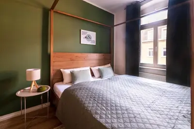 Ein Bett oder Betten in einem Zimmer der Unterkunft Design ElbOase-Zentral-Parkplatz-Waschmaschine-2 separate Schlafplätze