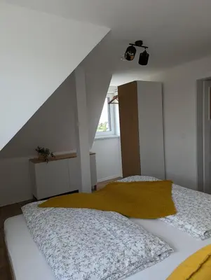 Ein Bett oder Betten in einem Zimmer der Unterkunft Ferienwohnung Alte Bäckerei
