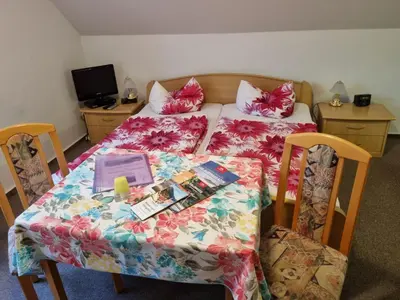 Ein Bett oder Betten in einem Zimmer der Unterkunft Gästehaus Teichmann