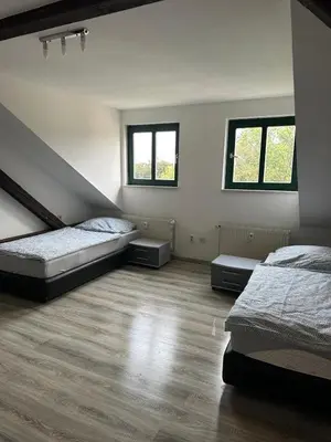 Ein Bett oder Betten in einem Zimmer der Unterkunft FeWo für 4 Personen in Wurzen
