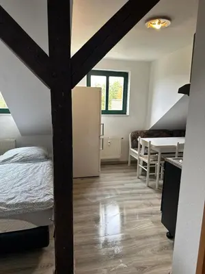 Ein Bett oder Betten in einem Zimmer der Unterkunft FeWo für 4 Personen in Wurzen