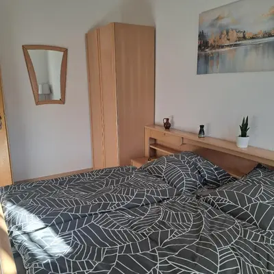 Ein Bett oder Betten in einem Zimmer der Unterkunft Ferienwohnung Reichel