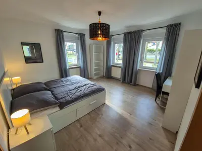 Ein Bett oder Betten in einem Zimmer der Unterkunft Villa Waldzauber