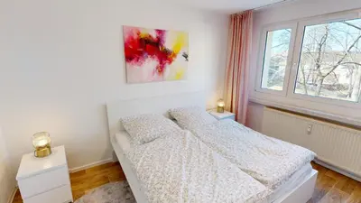 Ein Bett oder Betten in einem Zimmer der Unterkunft Ruhig gelegene 3-Raum-FeWo, WLAN