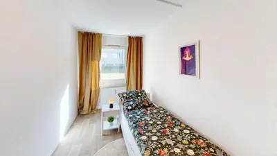 Ein Bett oder Betten in einem Zimmer der Unterkunft Ruhig gelegene 3-Raum-FeWo, WLAN