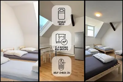 Ein Bett oder Betten in einem Zimmer der Unterkunft Einzelbetten, Waschmaschine, ideal für Gruppen