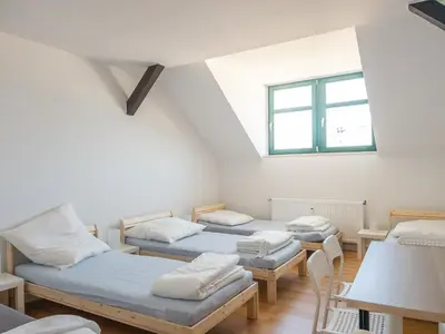 Ein Bett oder Betten in einem Zimmer der Unterkunft Einzelbetten, Waschmaschine, ideal für Gruppen