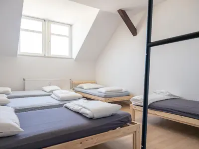 Ein Bett oder Betten in einem Zimmer der Unterkunft Einzelbetten, Waschmaschine, ideal für Gruppen