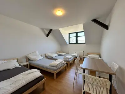 Ein Bett oder Betten in einem Zimmer der Unterkunft Einzelbetten, Waschmaschine, ideal für Gruppen