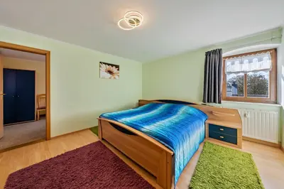 Ein Bett oder Betten in einem Zimmer der Unterkunft Idyllische Ferienwohnung am Pillnitzer Schlosspark