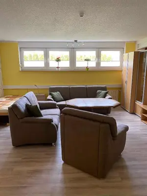 Ein Sitzbereich in der Unterkunft Pension und Ferienwohnung Kristen Am Denkmal Süptitzer Höhen