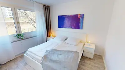 Ein Bett oder Betten in einem Zimmer der Unterkunft Family-Apartment mit Balkon und WLAN