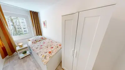Ein Bett oder Betten in einem Zimmer der Unterkunft Family-Apartment mit Balkon und WLAN