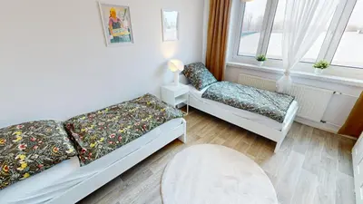 Ein Bett oder Betten in einem Zimmer der Unterkunft Lichterfülltes Apartment mit WLAN