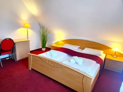 Ein Bett oder Betten in einem Zimmer der Unterkunft Pension Blümchen am Kiesgrube
