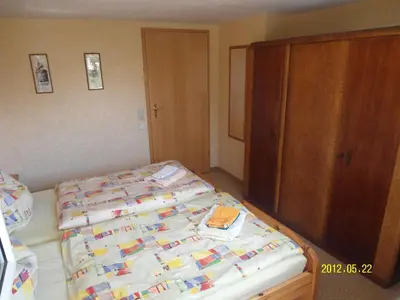 Ein Bett oder Betten in einem Zimmer der Unterkunft Winckler-Häuschen