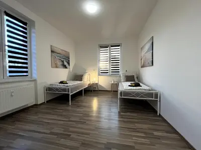Ein Bett oder Betten in einem Zimmer der Unterkunft MonteurWohnung Oskar06