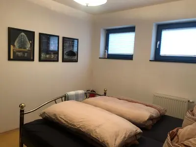 Ein Bett oder Betten in einem Zimmer der Unterkunft Maison Euba am Zeisigwald