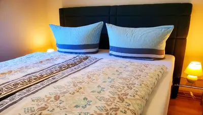 Ein Bett oder Betten in einem Zimmer der Unterkunft Café am Hirschgrund