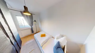 Ein Bett oder Betten in einem Zimmer der Unterkunft Urban gelegenes Apartment mit WLAN