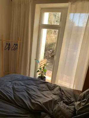 Ein Bett oder Betten in einem Zimmer der Unterkunft Cozy apartment