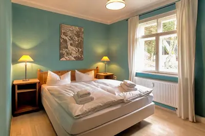 Ein Bett oder Betten in einem Zimmer der Unterkunft Apartment Schrammsteinblick 2